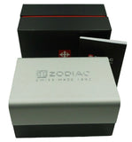 Zodiac watch packaging set featuring a white and black outer box, a black inner box with a red stripe, and a small booklet on a light gray background.
